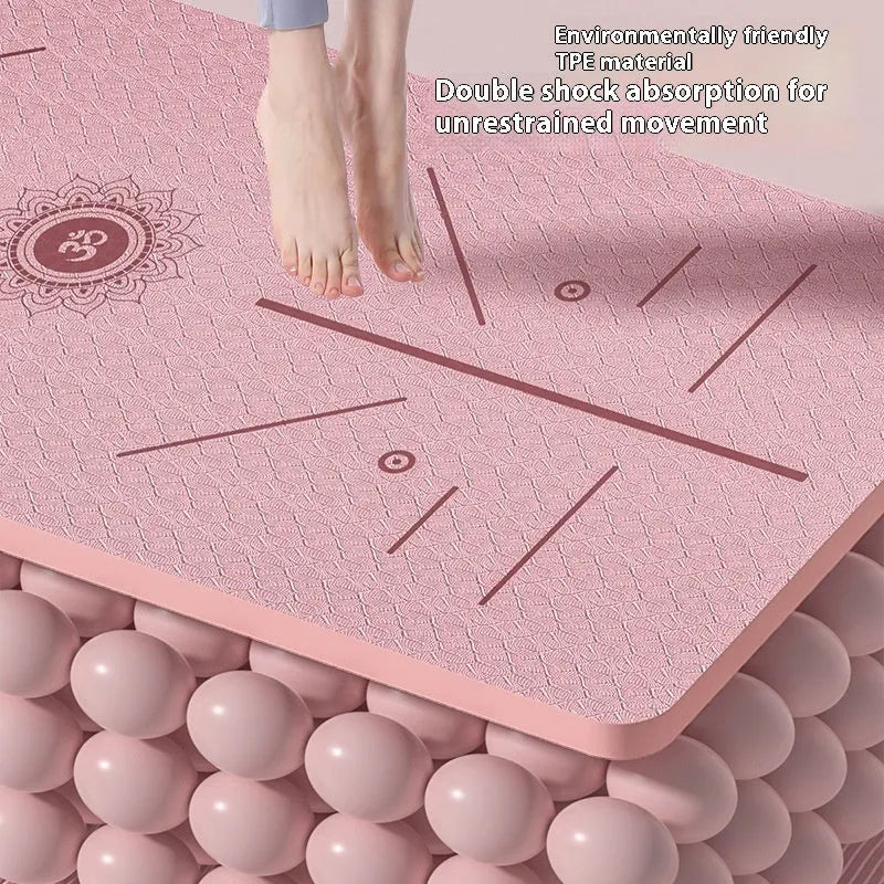A wide, long non-slip TPE gymnastic mat in a solid colour with alignment guide lines, shown rolled and unrolled.