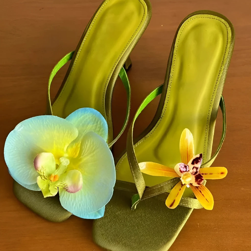 Women's handmade asymmetric flower sandals in calf leather with a square toe and high heel.