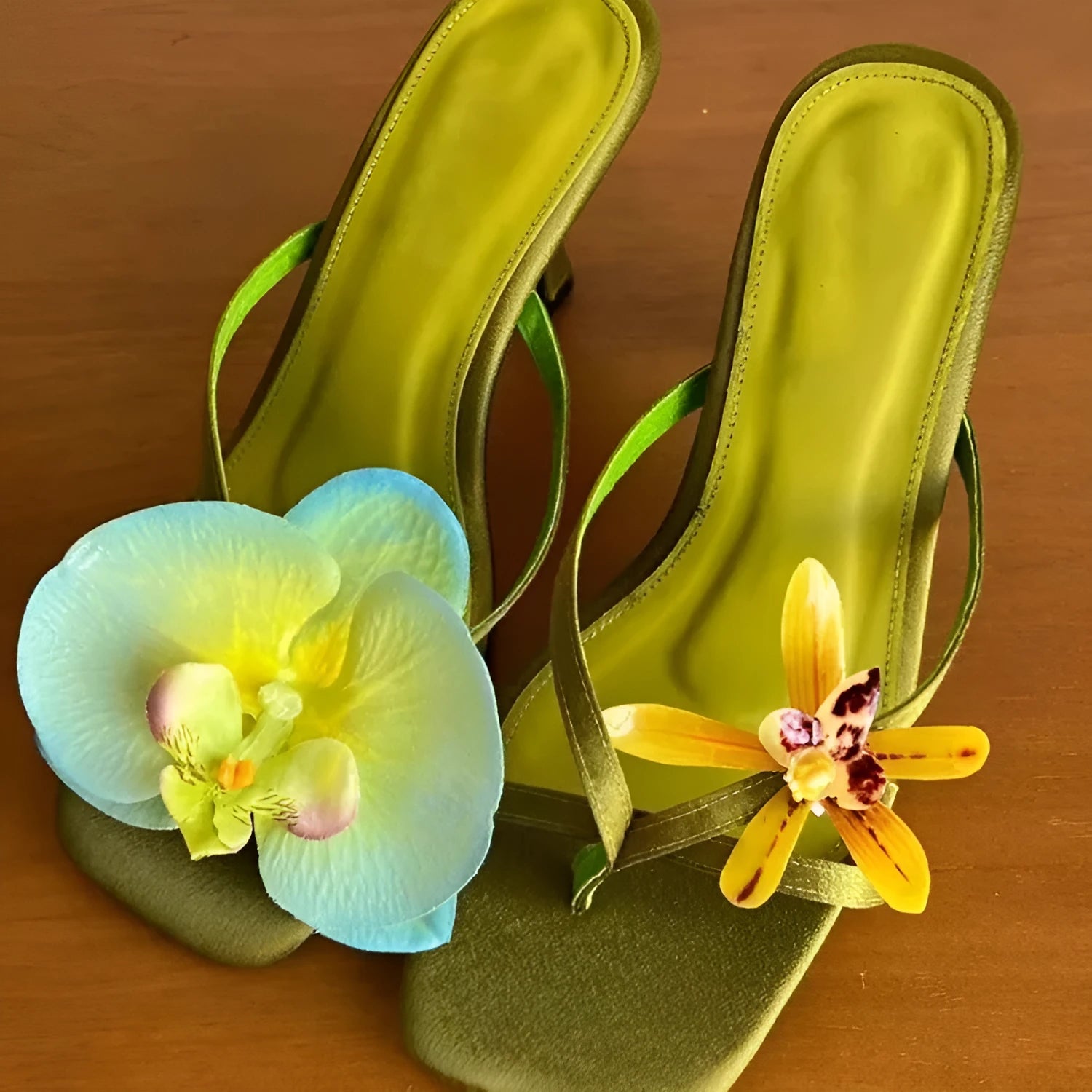 Women's handmade asymmetric flower sandals in calf leather with a square toe and high heel.