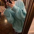 Women's loose fit pullover sweater in solid blue colour with regular sleeves
