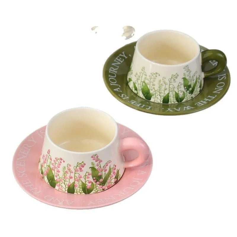 Ceramic coffee cup and saucer set for two people with stirring spoons