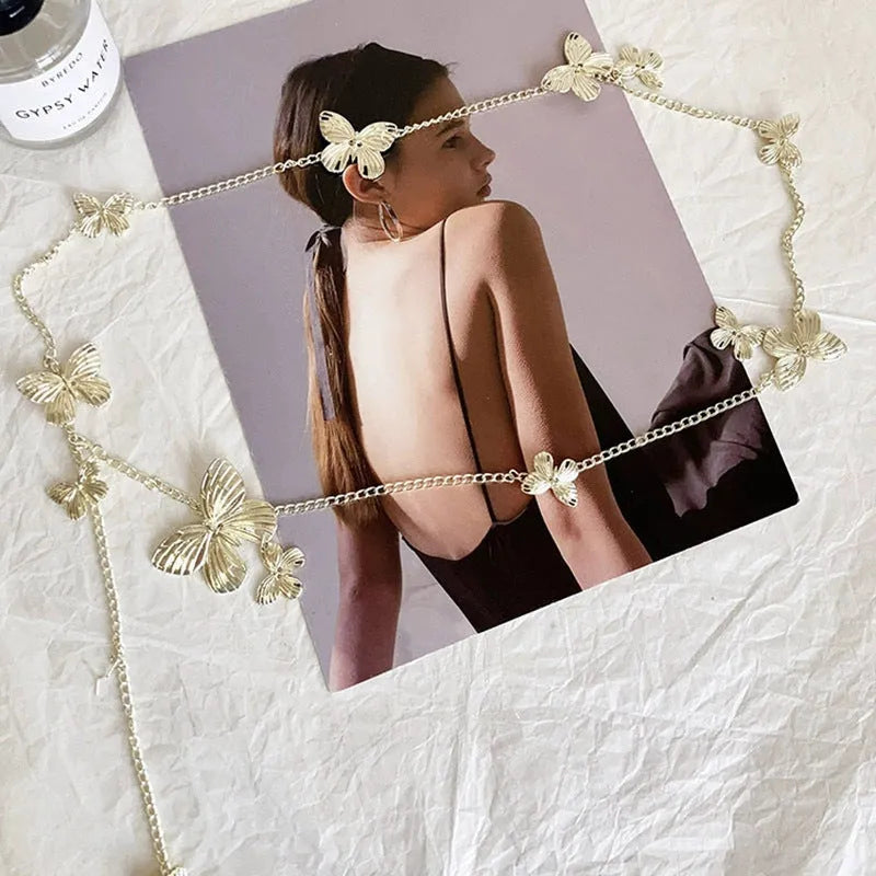 Gold butterfly waist chain for women, 104cm long and 40mm wide, shown laid flat.