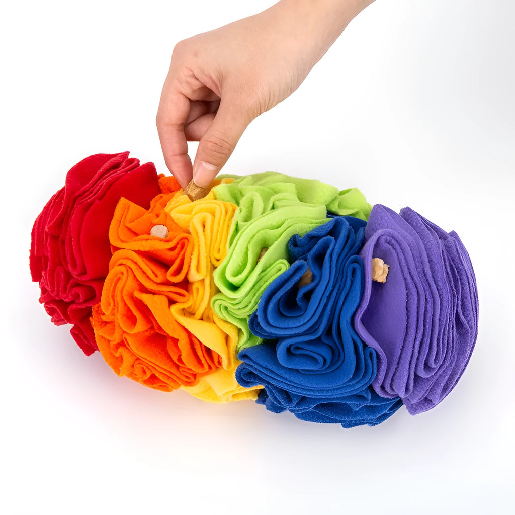 Dog snuffle pad in rainbow colour with polar fleece strips on a light background, 25x15cm size