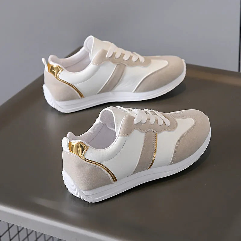 Women's casual flat sports shoes in grey with fabric canvas upper and PVC sole, low-top design