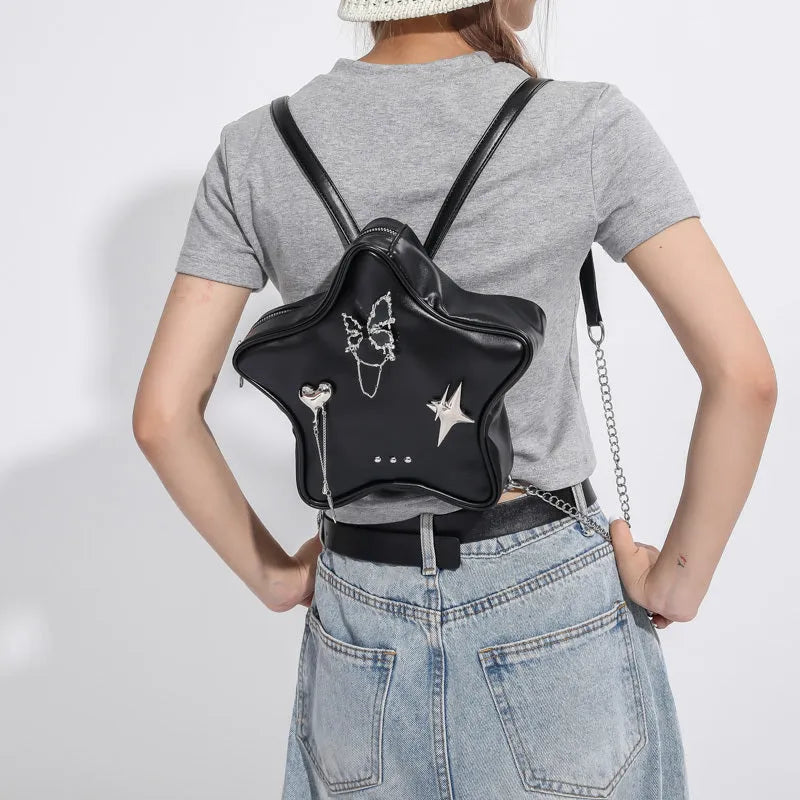 Women's soft PU leather mini backpack messenger bag in black showing crossbody strap