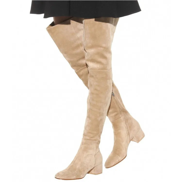 Grey suede women's over the knee flat boots with a pointed toe and thick low heel on a neutral background.