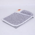 Large rectangular dog bed mat with a removable cover in a grey colour on a wooden floor.