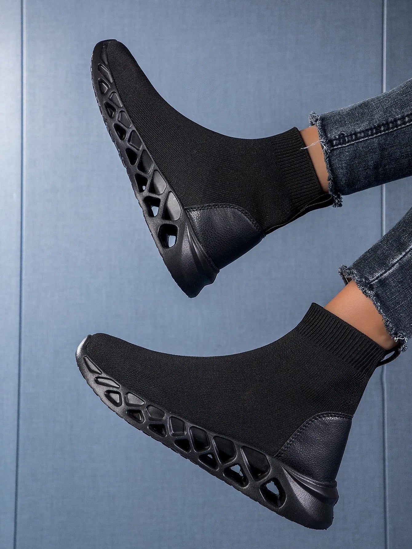 Women's black breathable mesh high-top casual sock boots with flat MD sole on a white background.