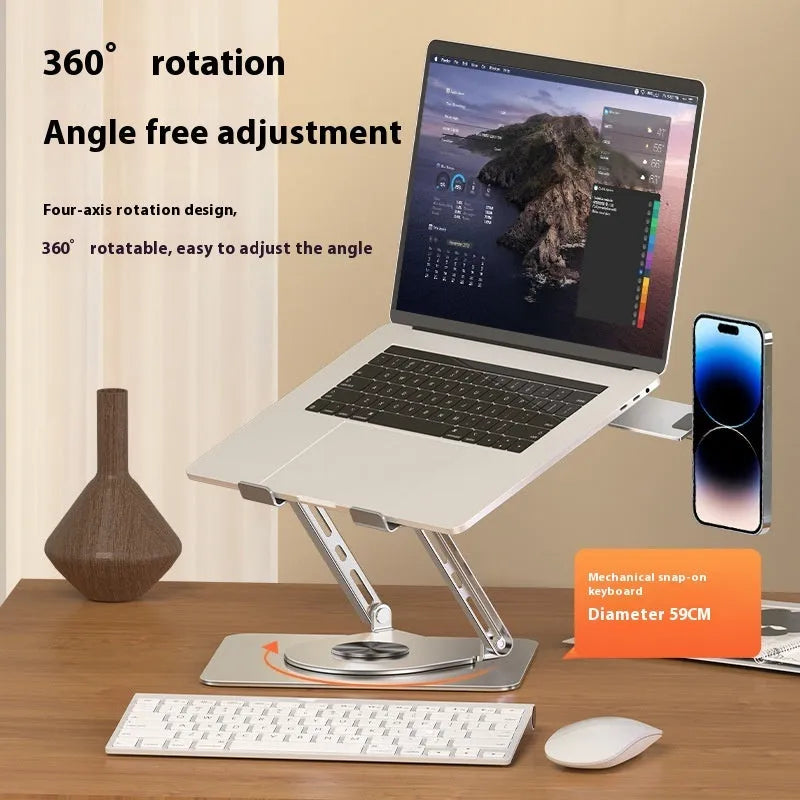 Silver carbon steel laptop stand with rotatable base and a side-mounted magnetic phone holder on a desk.