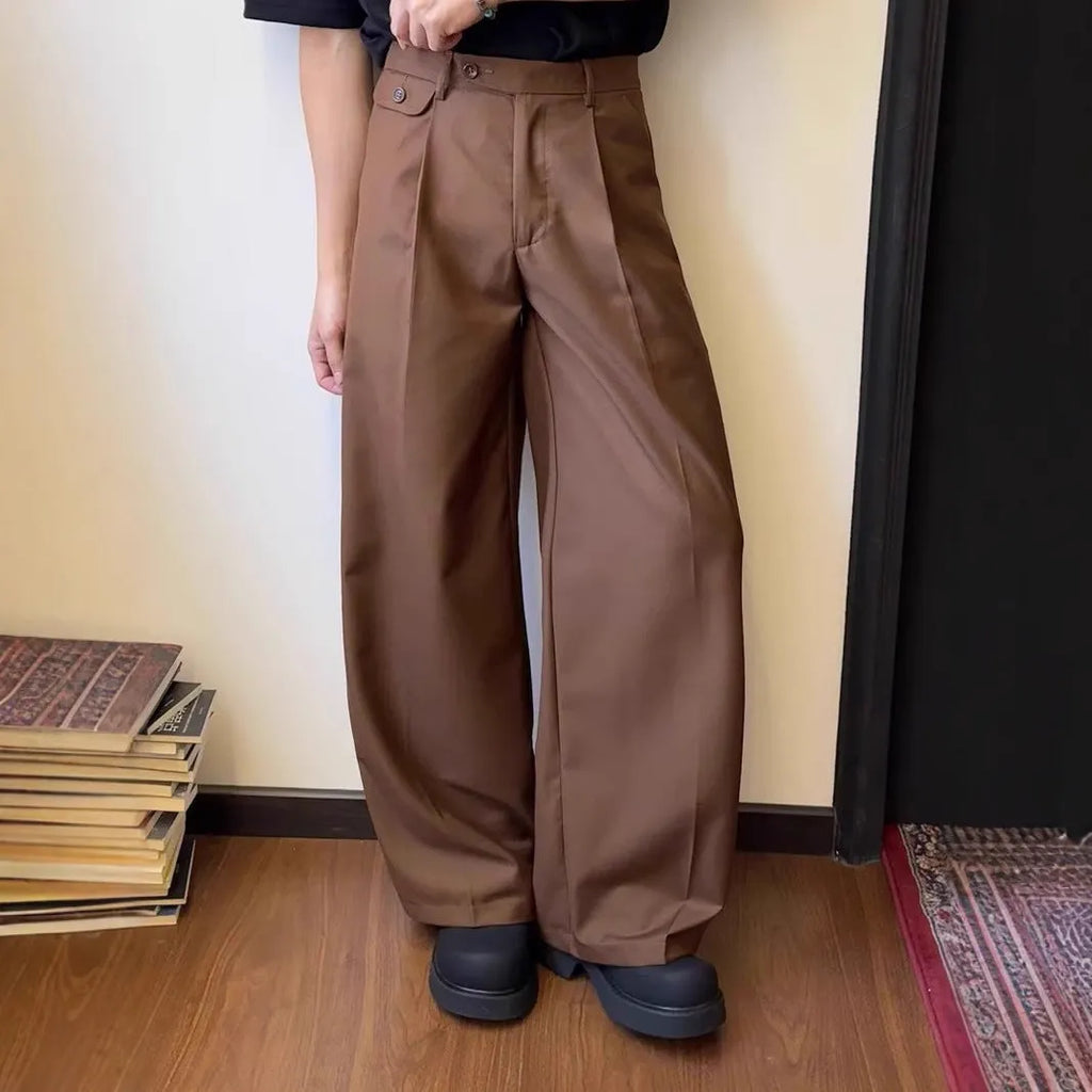 Men's straight-leg wide-leg casual trousers in black, showing loose fit and draping fabric.