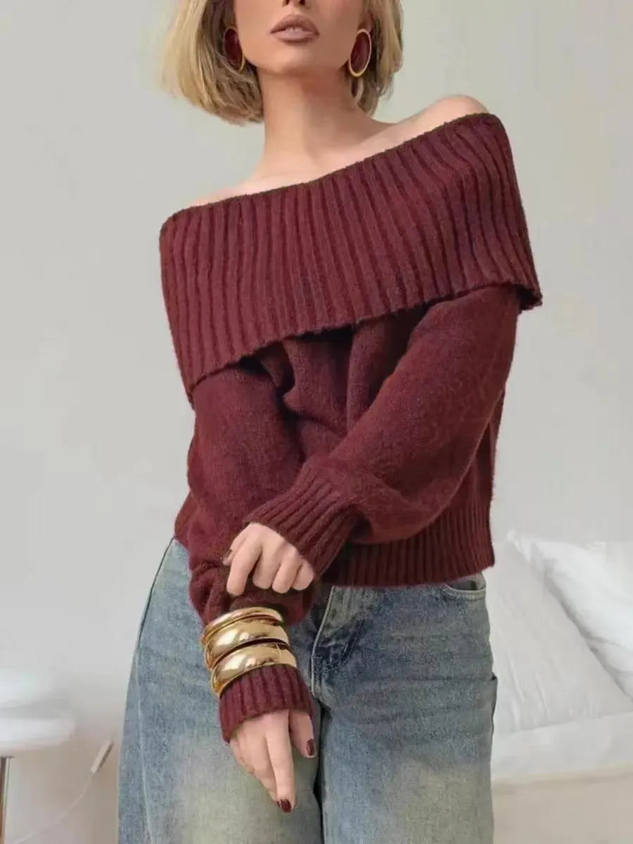 Grey strapless off-the-shoulder sweater with a 3D pattern on a mannequin.