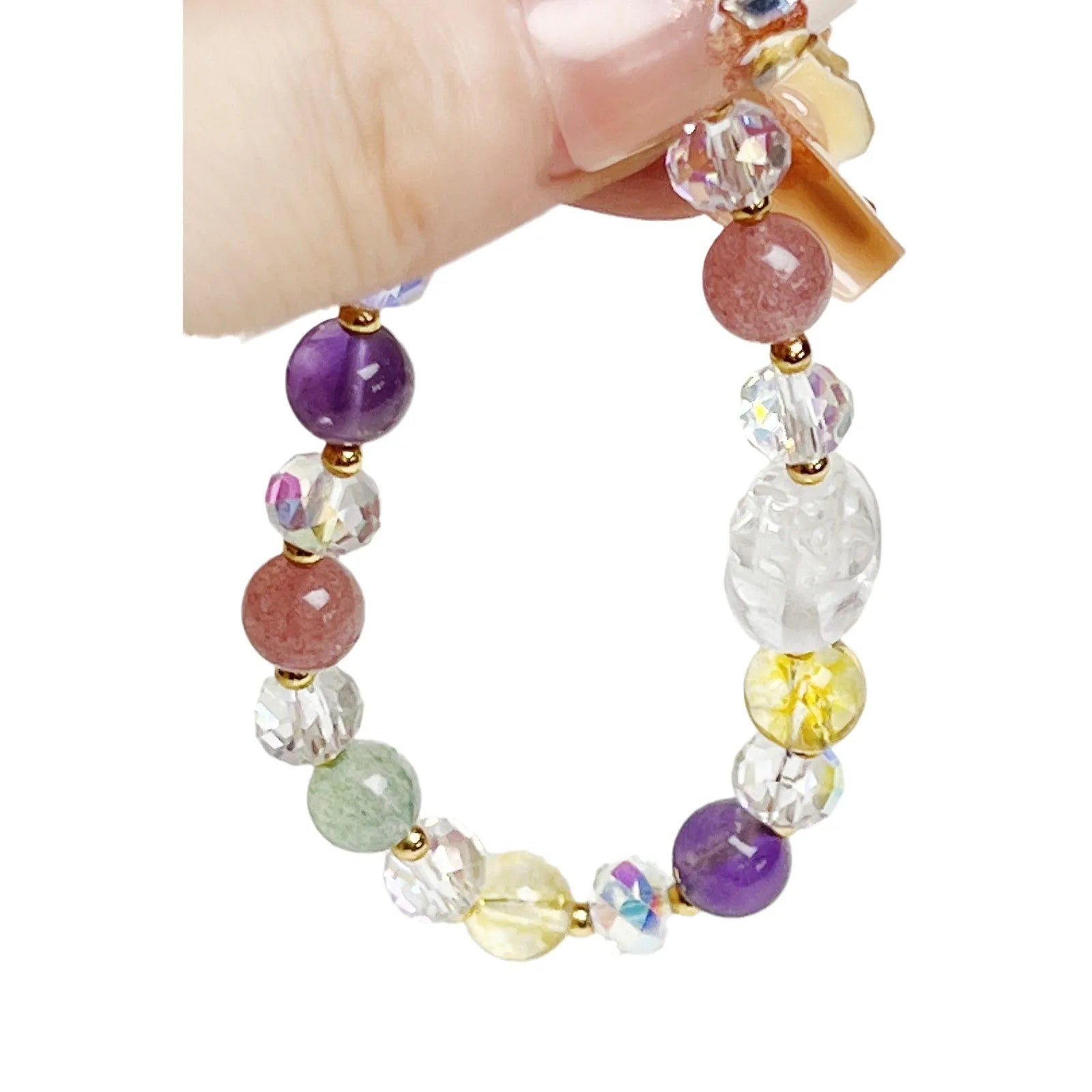 Close-up of a women's crystal bracelet with a detailed nine-tailed fox charm and colour faceted stones.