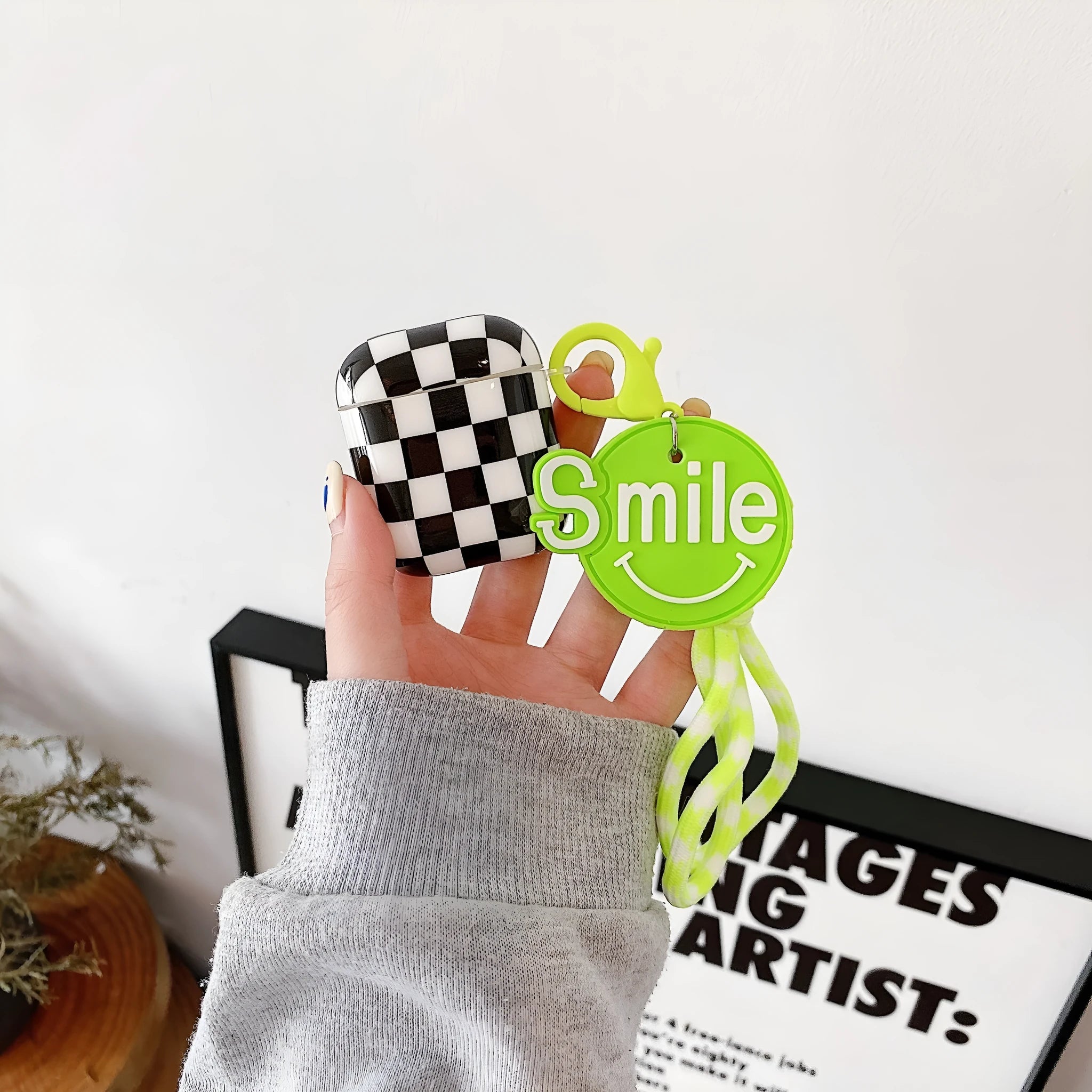 Black and green checkerboard pattern TPU case for Apple AirPods with optional pendant attachments