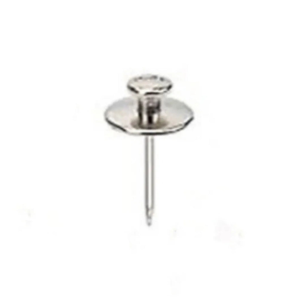 Fancy thumb tack set in mixed colours black gold silver bronze on a corkboard surface