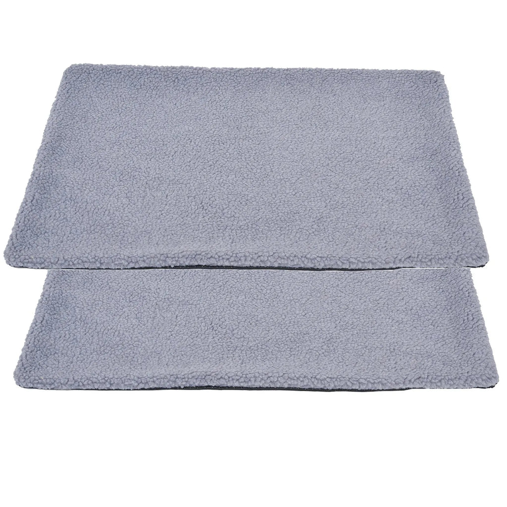 Grey self-heating plush pet pad for cats on a wooden floor