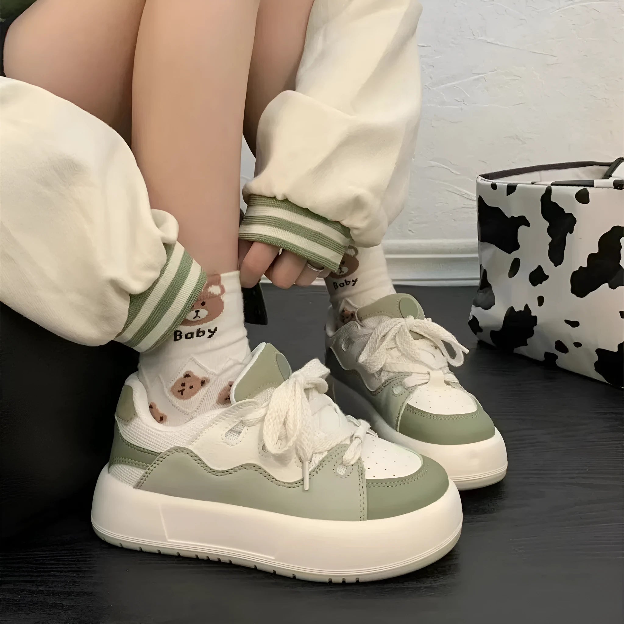 Green women's casual shoes with flat heel and round toe design showing pu mesh upper material