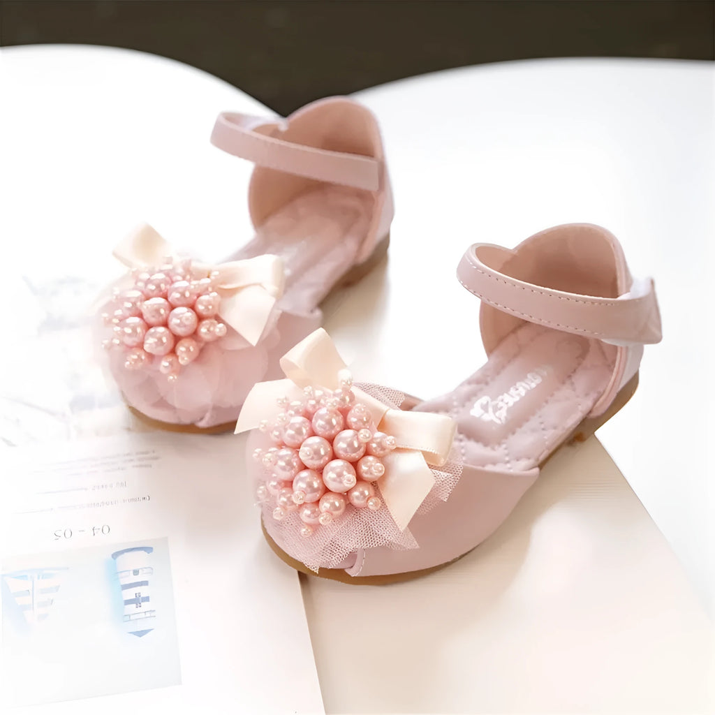 Girls princess peep toe sandals with pearl flower decoration in beige colour on display