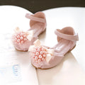 Girls princess peep toe sandals with pearl flower decoration in beige colour on display
