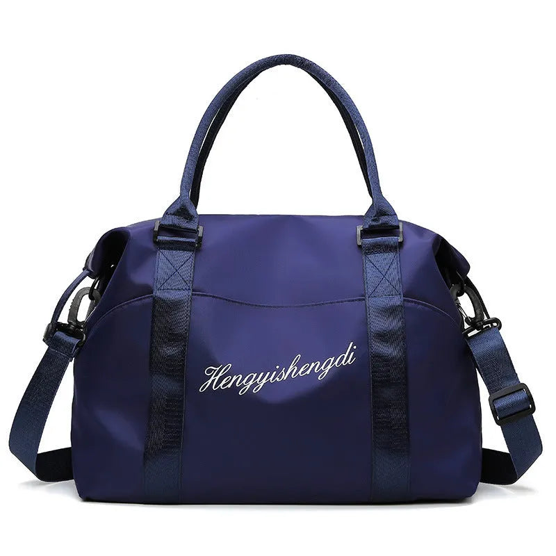 Medium fitness sports travel duffel bag in Oxford cloth with zip closure, soft handle, and luggage belt