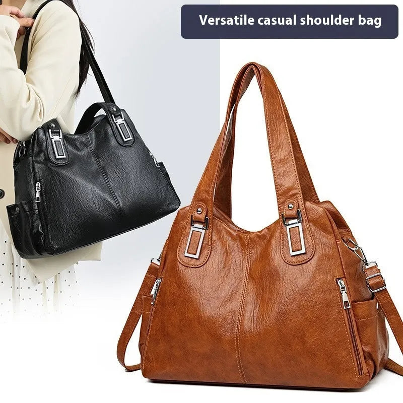 Soft PU women's tote bag in square vertical model with single shoulder strap showing internal organisational pockets