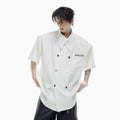 Men's loose-fitting casual short-sleeved shirt in blue with lapel collar and button detail.