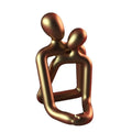 Modern simple style resin statue of a couple in milky white or gold colour.