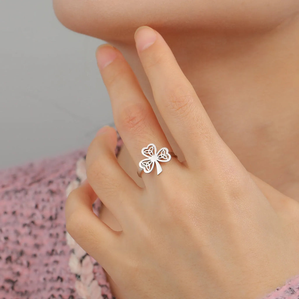 Stainless steel hollow ring with lucky symbol design in gold or steel finish