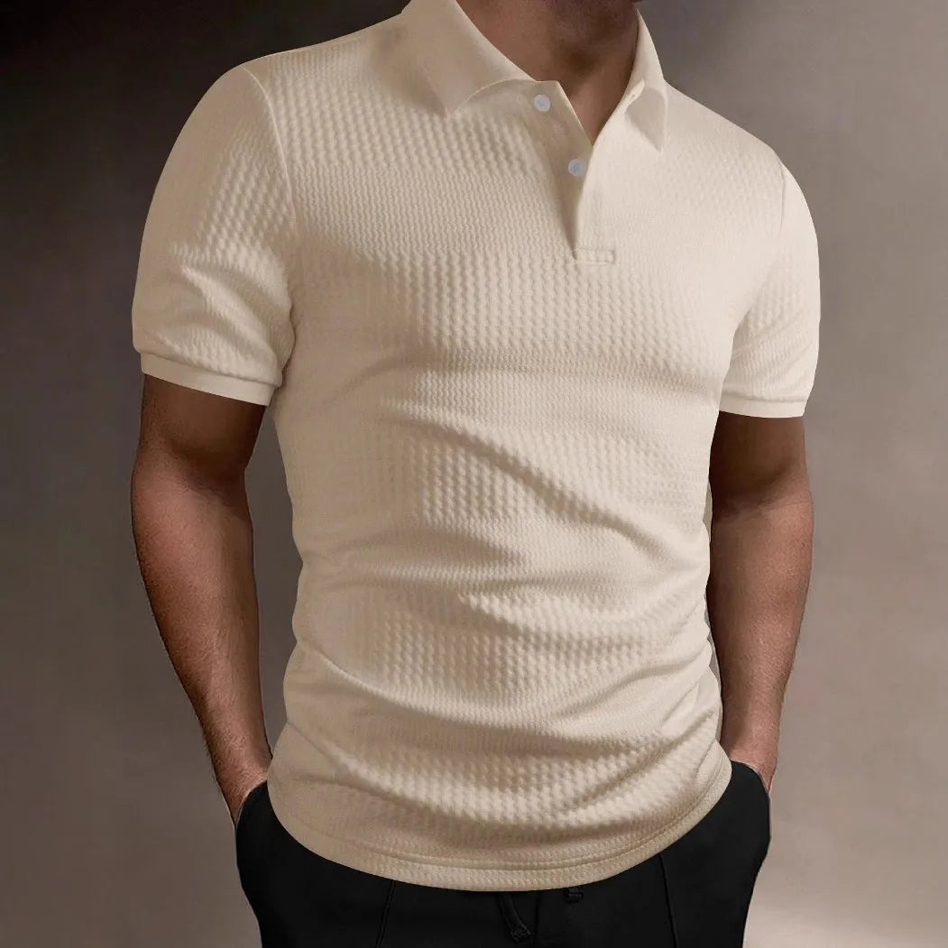 Man wearing a loose fit striped polo shirt in a light blue colour with an asymmetric design detail.