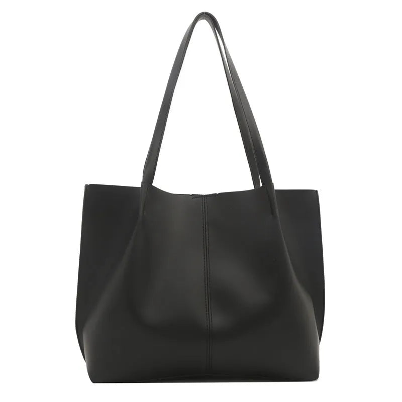 PU leather messenger bag in bucket shape with stitching detail, black colour, double shoulder straps, open pocket outer