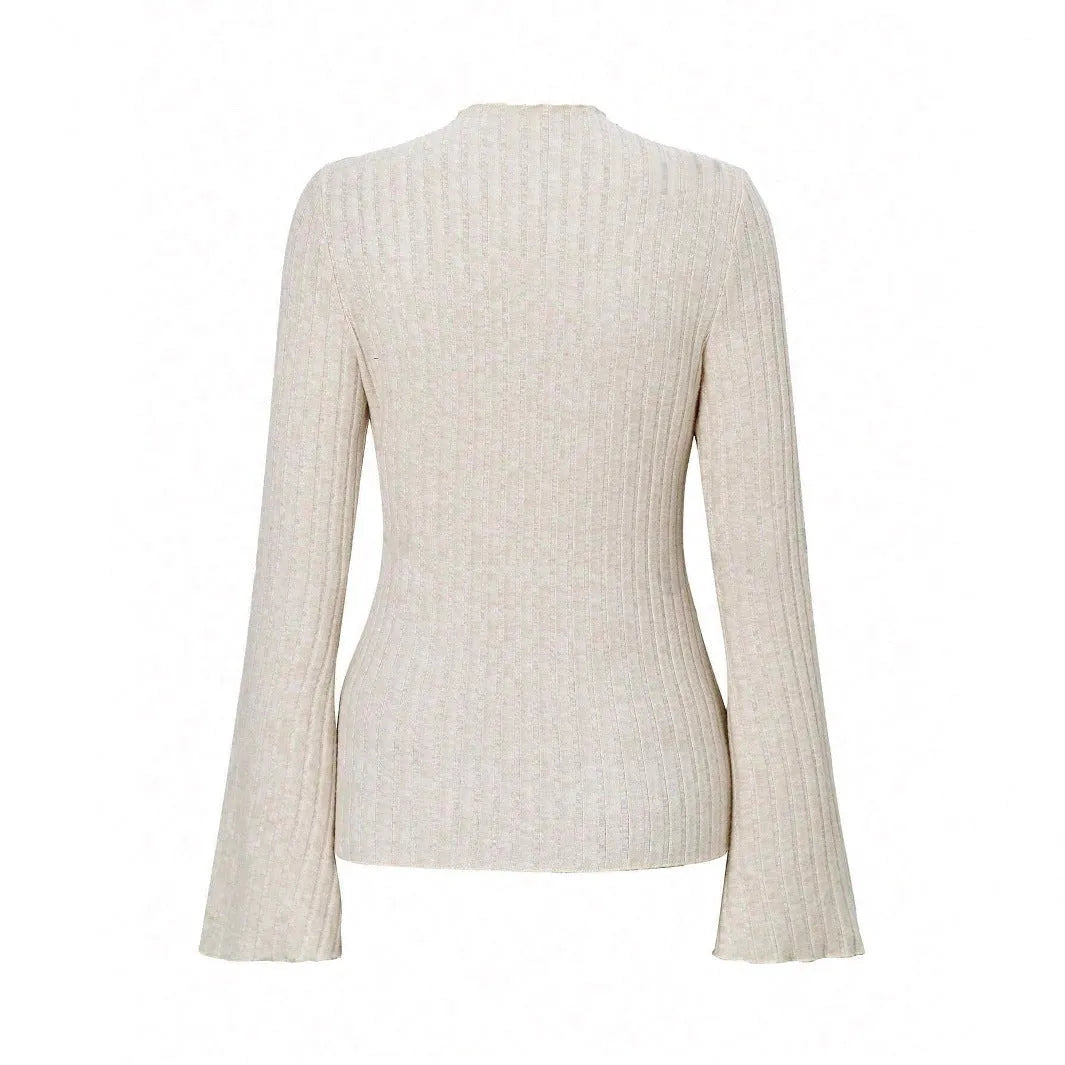 Black slim-fit long sleeve top with round neck and subtle sunken stripe pattern on soft brushed fabric.