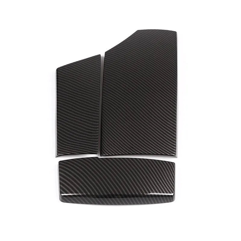 Three black ABS car armrest protective covers with a shiny diagonal carbon fibre weave pattern.