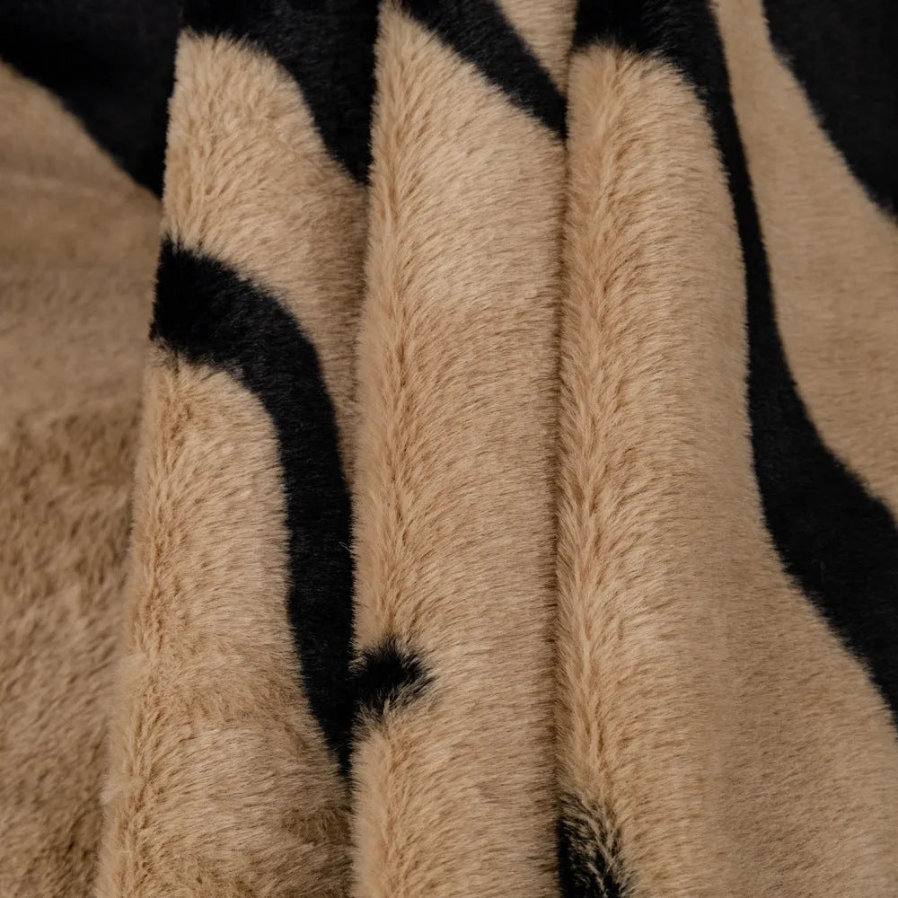 Zebra pattern flannel sofa cover in caramel colour, laid flat showing its size and non-slip textured fabric.