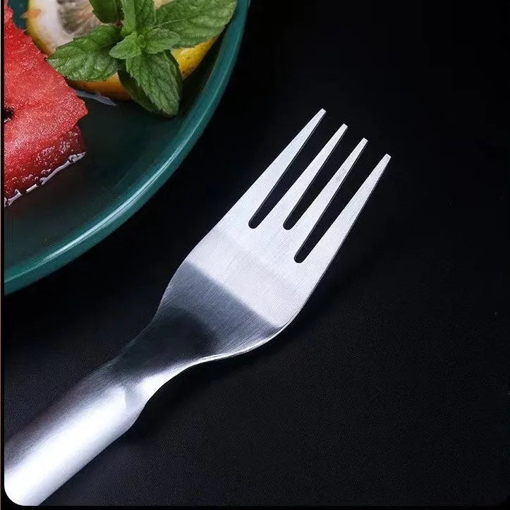 Stainless steel watermelon slicer and fork tool on a kitchen surface