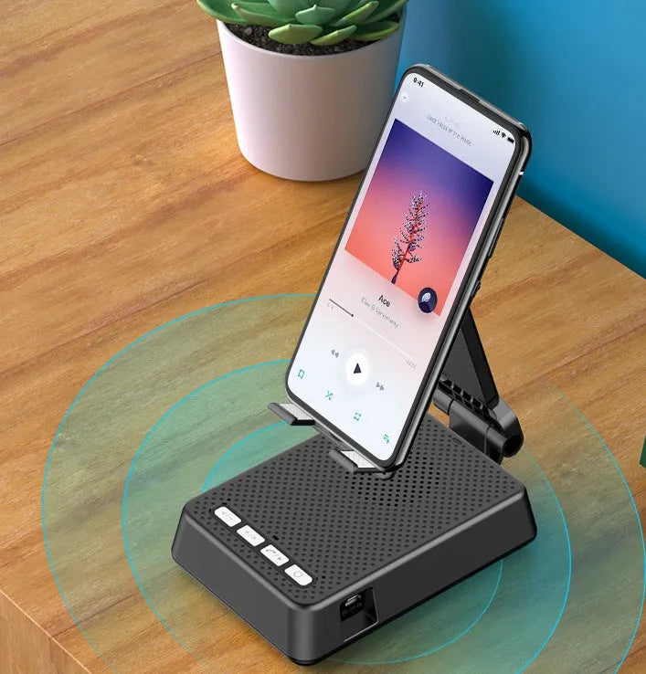 Black mobile phone broadcasting stand with Bluetooth speaker and microphone on desk