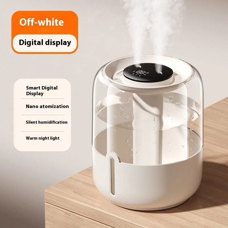 Beige round USB humidifier with display screen and dual mist outlets on a table