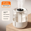 Beige round USB humidifier with display screen and dual mist outlets on a table