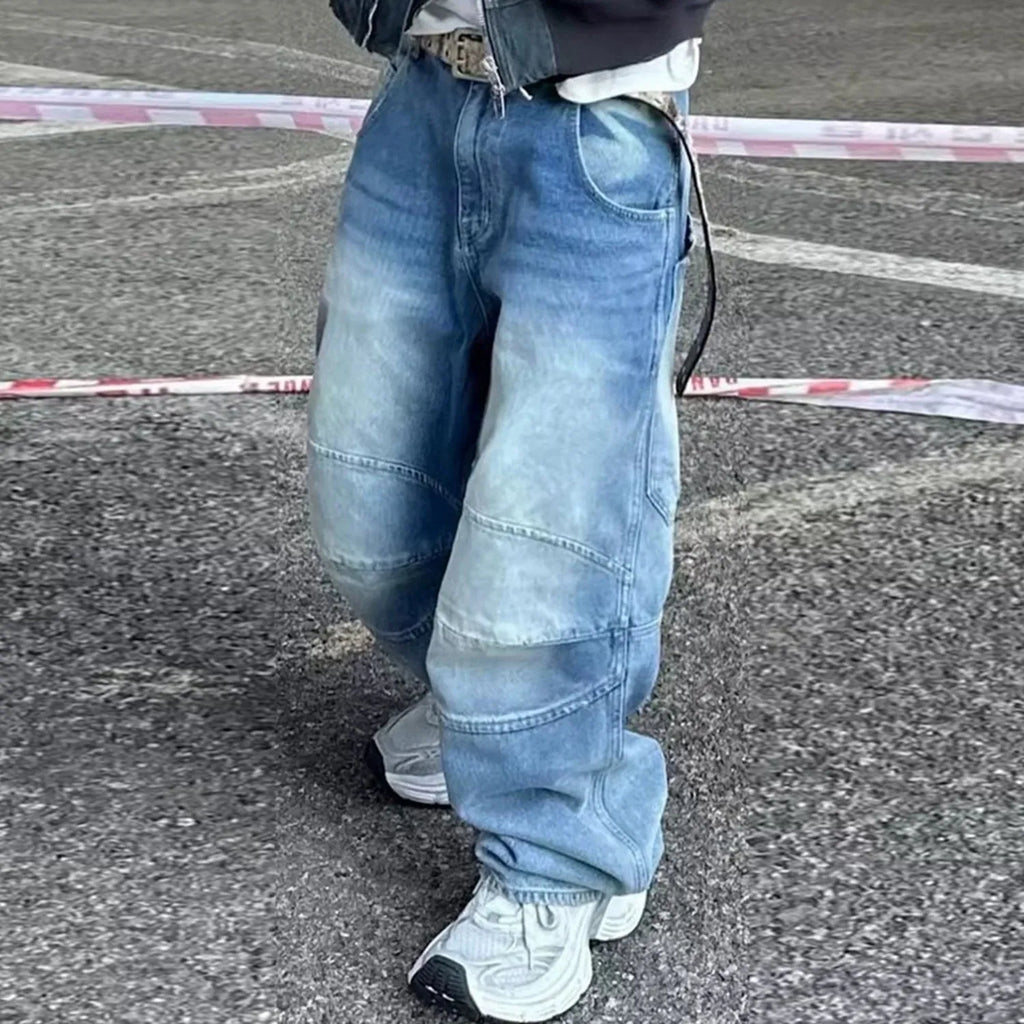 Blue baggy straight-leg jeans with a zip fly, shown in a washed white blue colour.