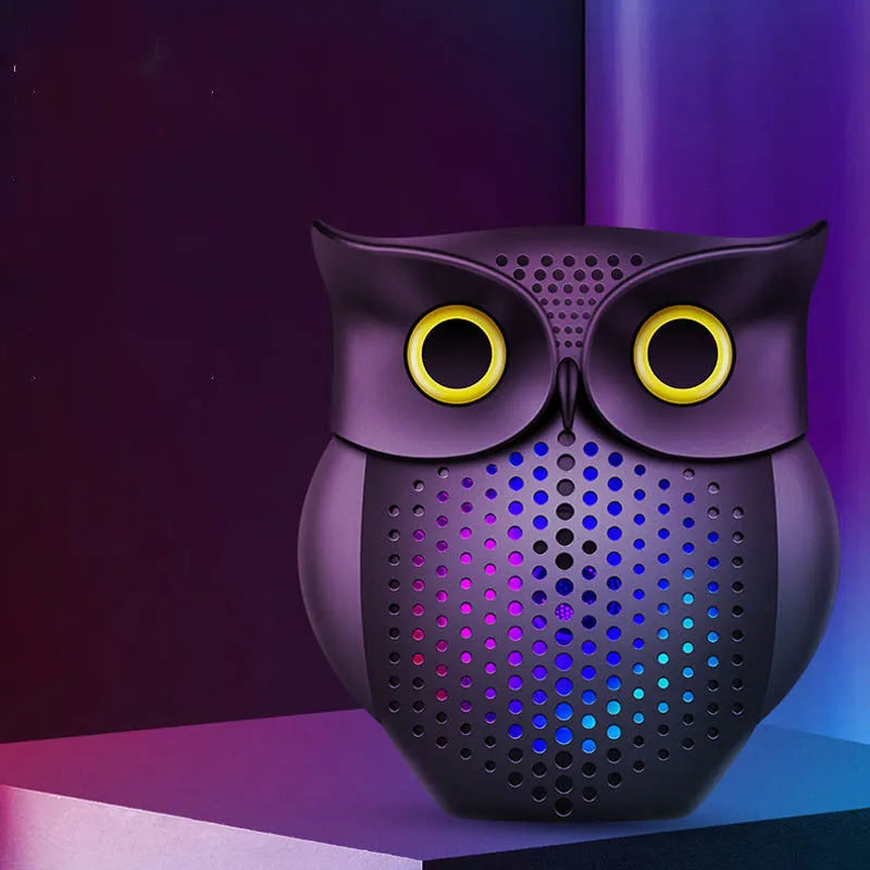 Black owl-designed wireless Bluetooth speaker with USB cable