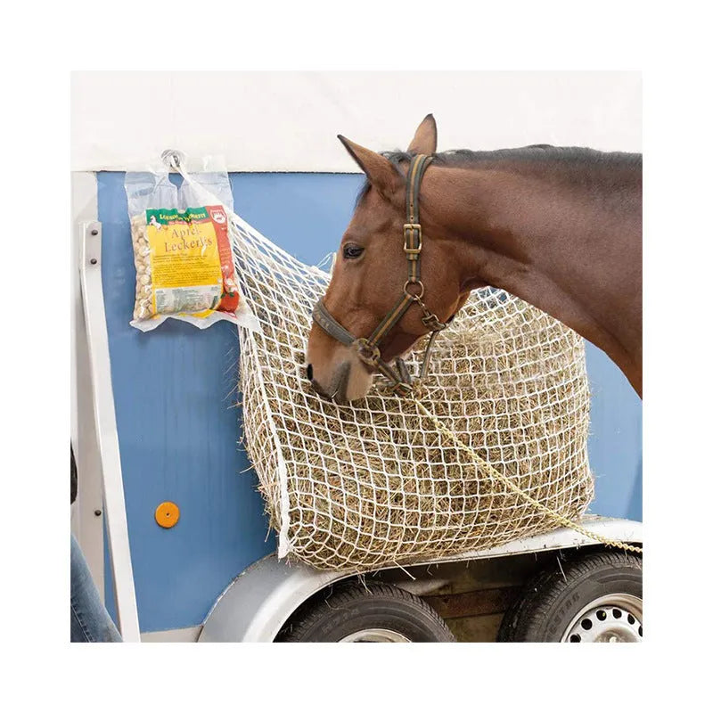 Black woven PE rope grid feeding bag hanging, sized for a horse.
