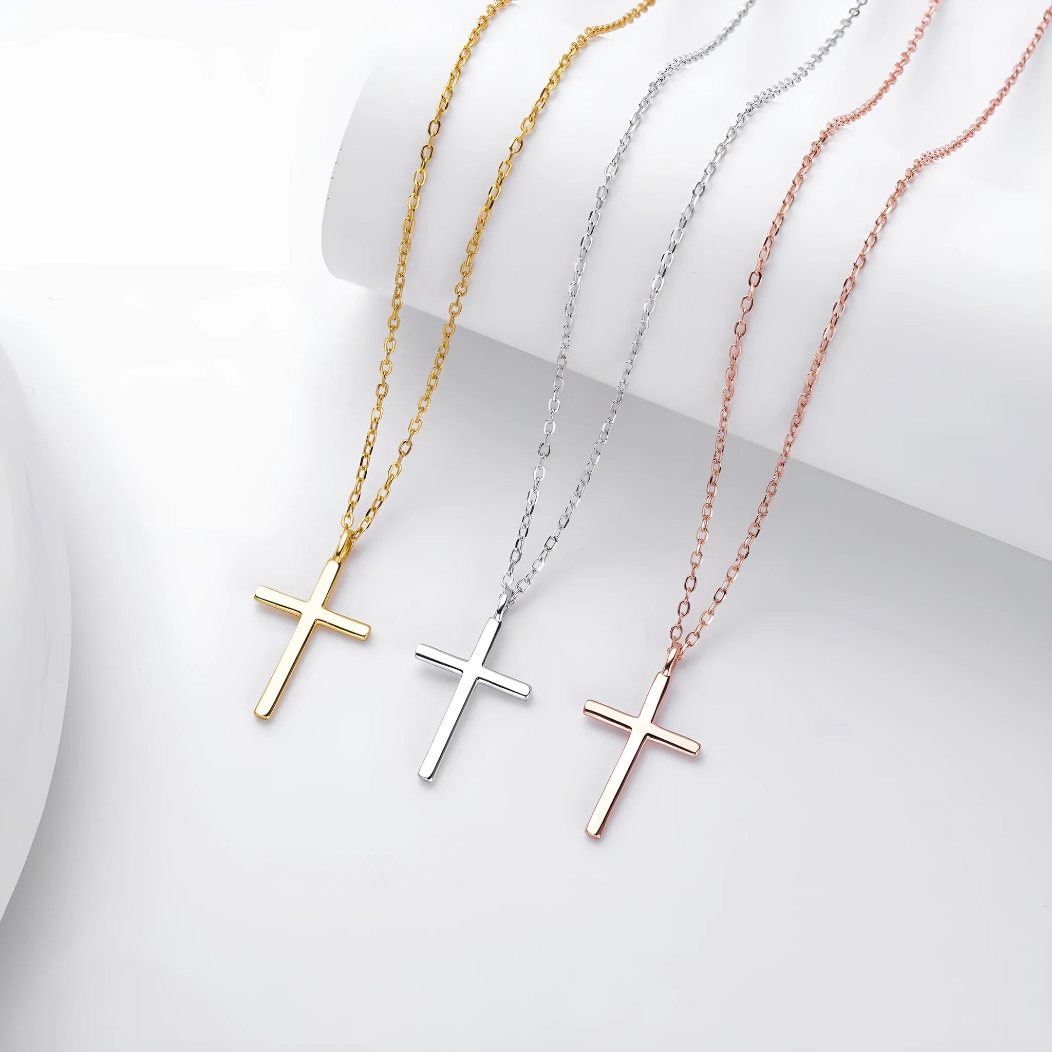S925 sterling silver necklace with glossy cross pendant on O-chain in gold, platinum, or rose gold plating.