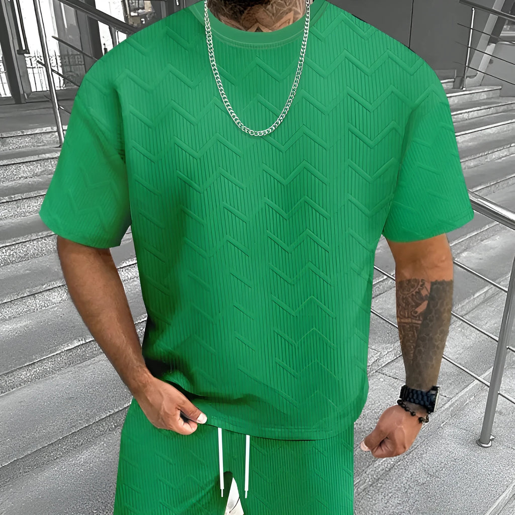 Men's short sleeve top and shorts suit in a printed polyester blend fabric.