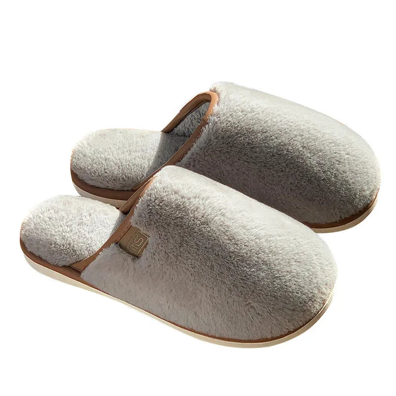 A pair of solid-colour winter plush slippers with a non-slip PVC sole, shown in a selection of available colours.