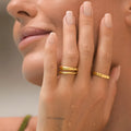 Stainless steel irregular wave ring with electroplated colour finish on hand