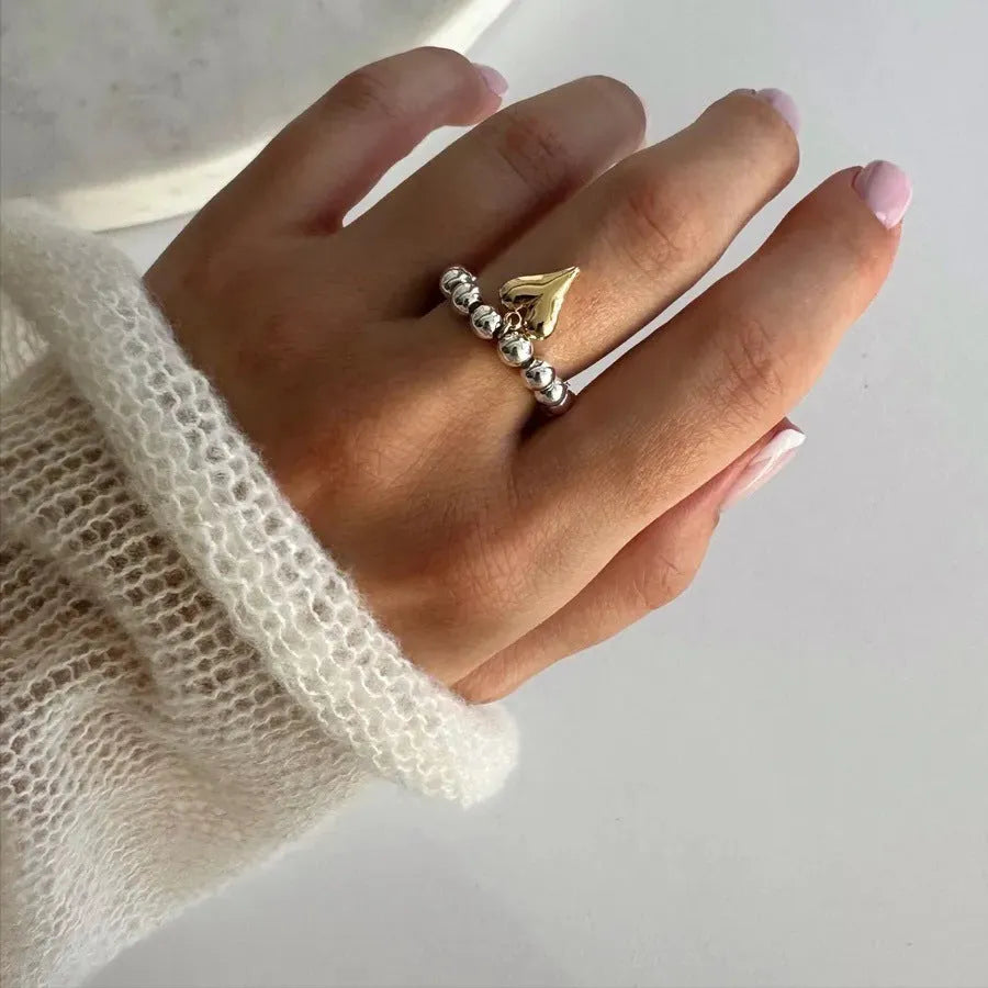 Handmade elastic beaded ring with love heart design in gold or white colour