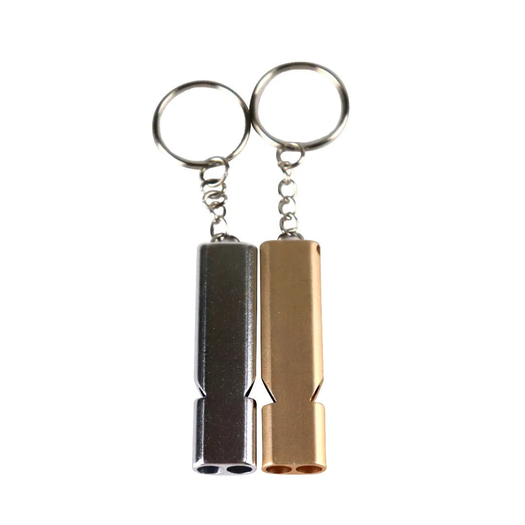 Silver and gold coloured aluminium alloy double-hole outdoor survival whistle with keychain.