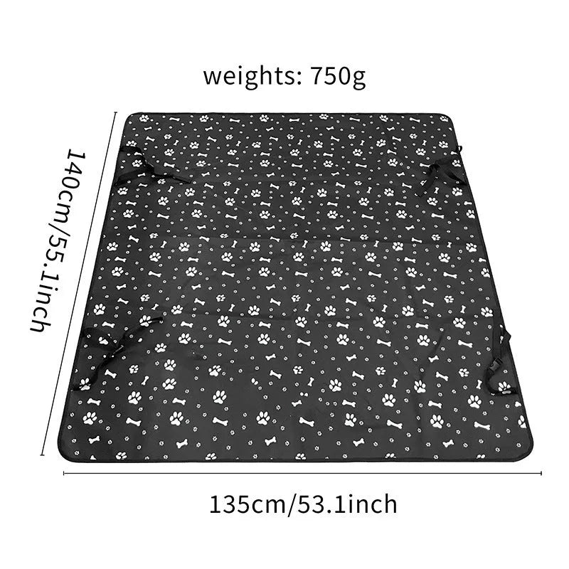 Water resistant dog car seat cover mat on a rear car seat in a bone print pattern.