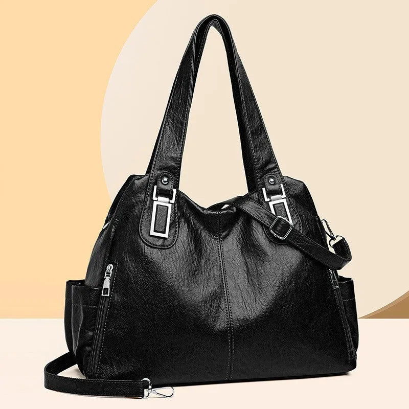 Soft PU women's tote bag in square vertical model with single shoulder strap showing internal organisational pockets
