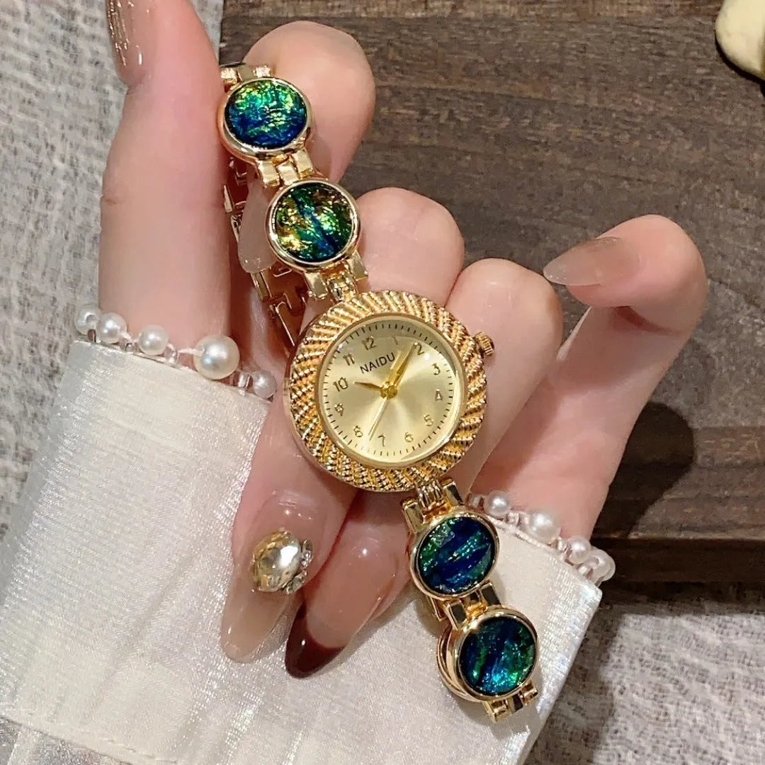 Women's round quartz watch with 25mm dial in zinc alloy case, showing colour options.