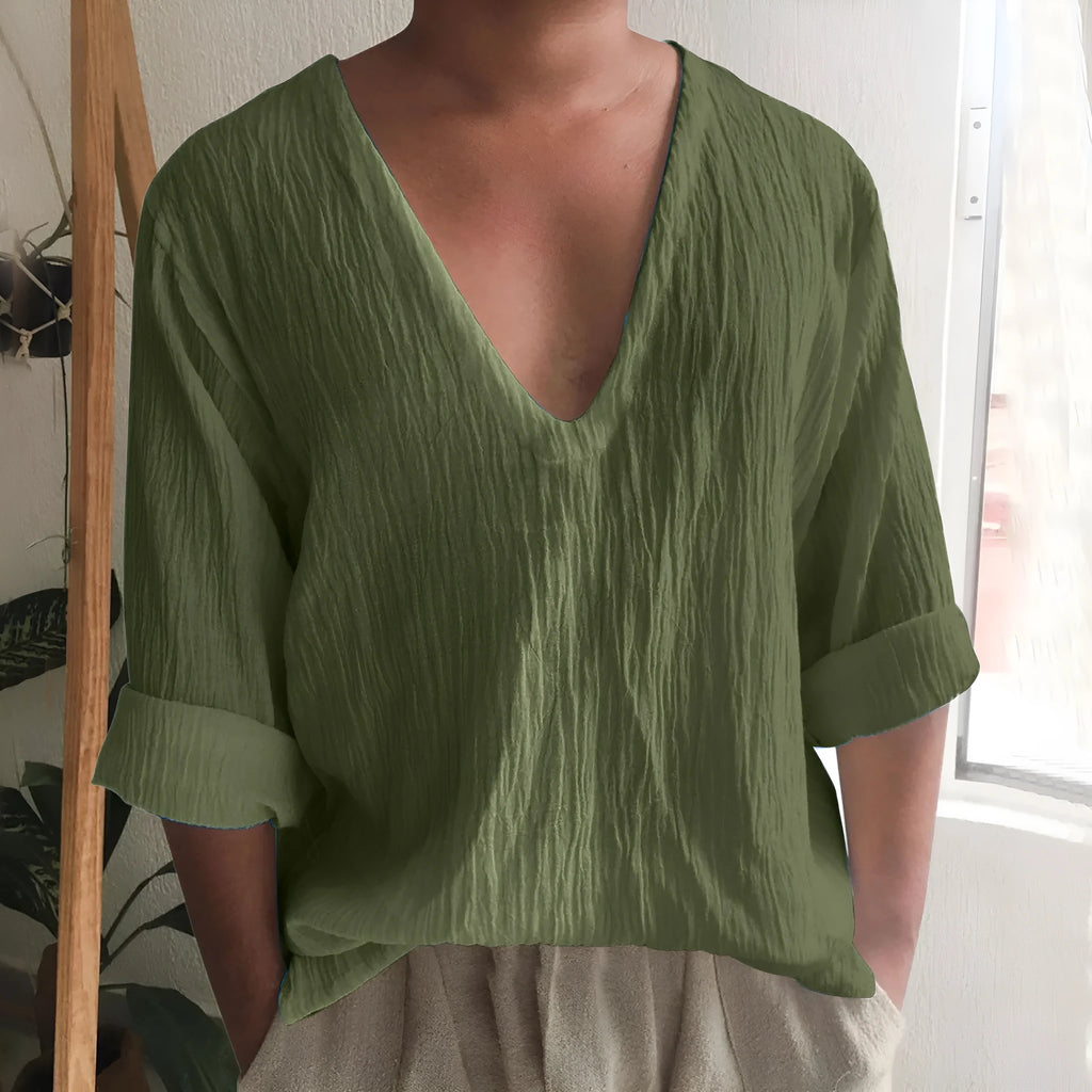 Man modelling a long sleeve V-neck T-shirt in washed cotton, available in multiple solid colours.