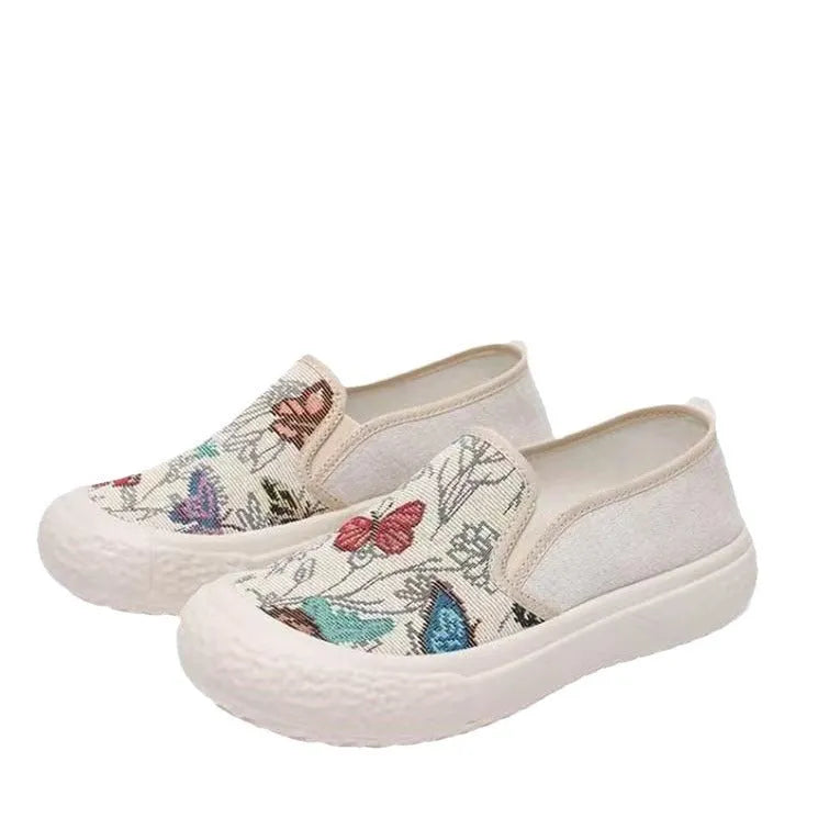 Women's slip-on canvas shoes in Black with round toe and decorative sewing thread details